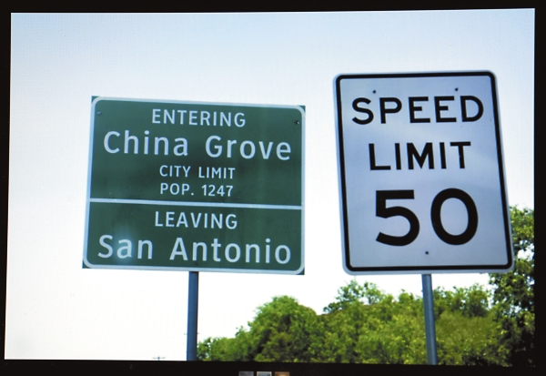 A traffic sign at the entrance of China Grove, TX when leaving San Antonio.